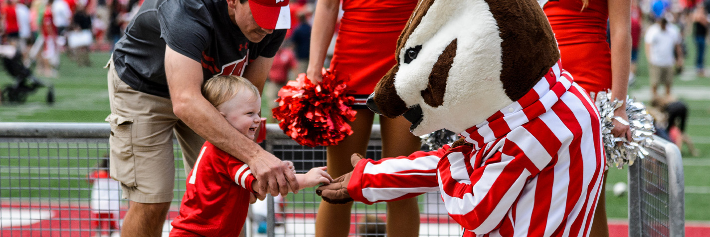 a child gives Bucky a high-five